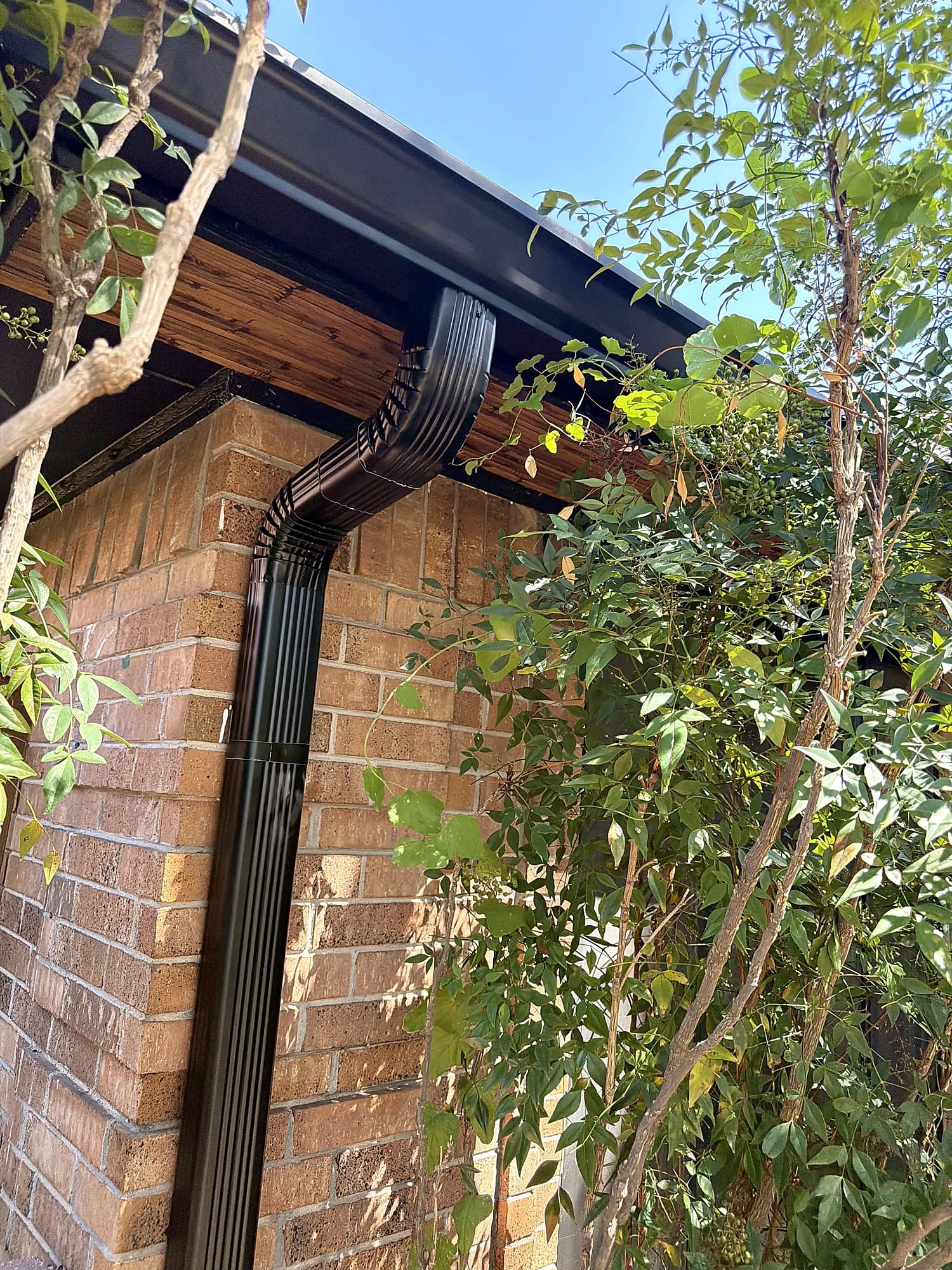 Close view of a gutter corner and downspout