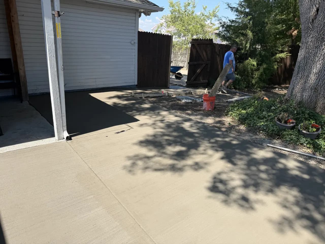 New concrete patio beside a home