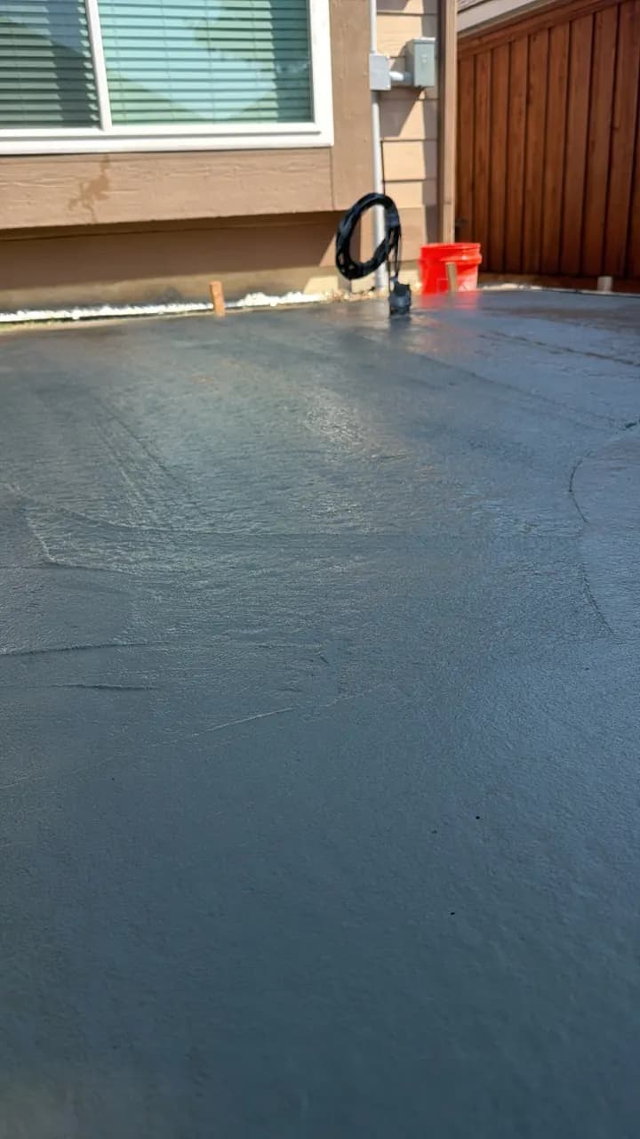 Freshly poured concrete patio by Rugged American Exteriors